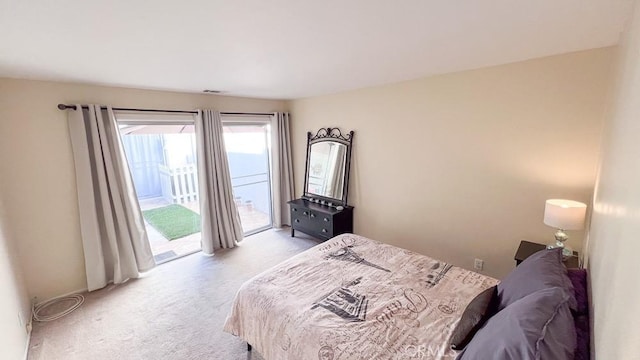 3621 Vista Campana S Unit 56, Oceanside, CA 92057 - bedroom with light colored carpet and access to outside