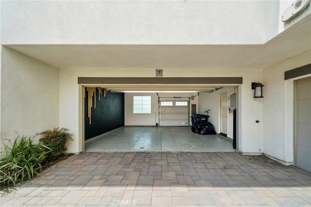 3860 S Oasis Paseo Unit 7, Ontario, CA 91761 - garage featuring decorative driveway