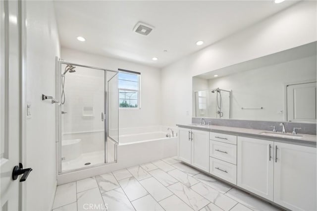 3860 S Oasis Paseo Unit 7, Ontario, CA 91761 - full bath featuring a garden tub, a sink, marble finish floor, and a stall shower