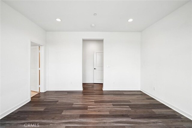3860 S Oasis Paseo Unit 7, Ontario, CA 91761 - spare room featuring recessed lighting, baseboards, and wood finished floors
