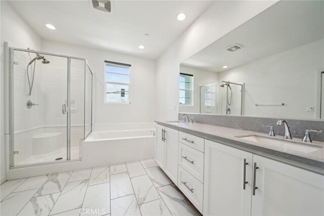 3860 S Oasis Paseo Unit 7, Ontario, CA 91761 - bathroom with double vanity, marble finish floor, a bath, a shower stall, and a sink