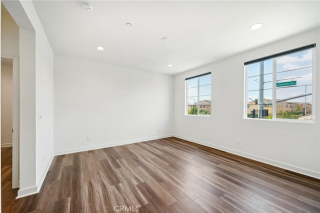 3860 S Oasis Paseo Unit 7, Ontario, CA 91761 - unfurnished room with recessed lighting, baseboards, and wood finished floors