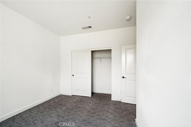 3860 S Oasis Paseo Unit 7, Ontario, CA 91761 - unfurnished bedroom with baseboards, dark colored carpet, and visible vents