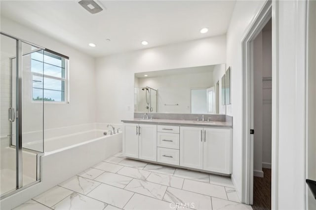 3860 S Oasis Paseo Unit 7, Ontario, CA 91761 - full bath with double vanity, a sink, a bath, and a stall shower