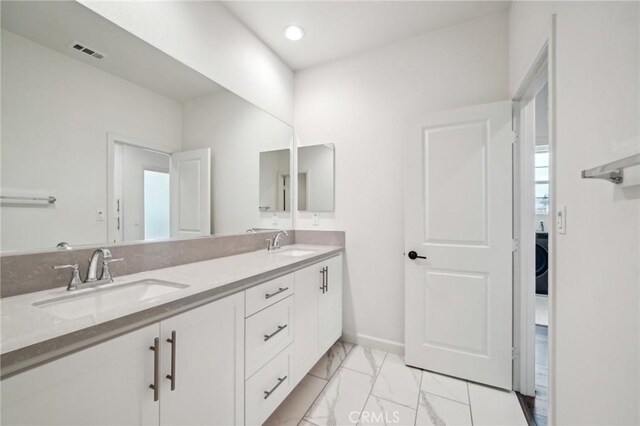 3860 S Oasis Paseo Unit 7, Ontario, CA 91761 - full bath with double vanity, visible vents, a sink, and marble finish floor