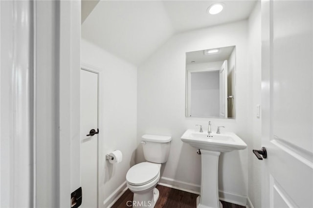 3860 S Oasis Paseo Unit 7, Ontario, CA 91761 - half bath featuring baseboards, lofted ceiling, wood finished floors, and toilet