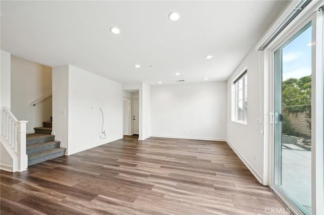 3860 S Oasis Paseo Unit 7, Ontario, CA 91761 - unfurnished living room with recessed lighting, baseboards, stairs, and wood finished floors