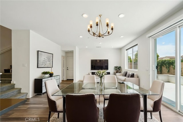 3860 S Oasis Paseo Unit 7, Ontario, CA 91761 - dining area featuring stairs, recessed lighting, an inviting chandelier, and wood finished floors