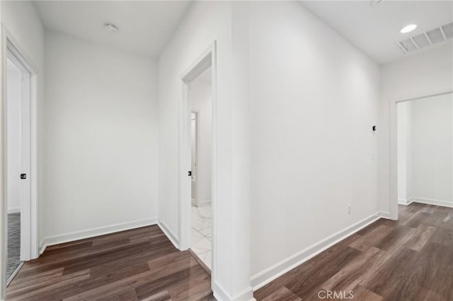 3860 S Oasis Paseo Unit 7, Ontario, CA 91761 - corridor with dark wood-style flooring, baseboards, and visible vents