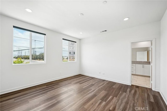 3860 S Oasis Paseo Unit 7, Ontario, CA 91761 - unfurnished bedroom with visible vents, recessed lighting, dark wood finished floors, and baseboards