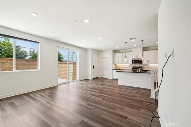 3860 S Oasis Paseo Unit 7, Ontario, CA 91761 - unfurnished living room with baseboards, recessed lighting, dark wood-style floors, and visible vents