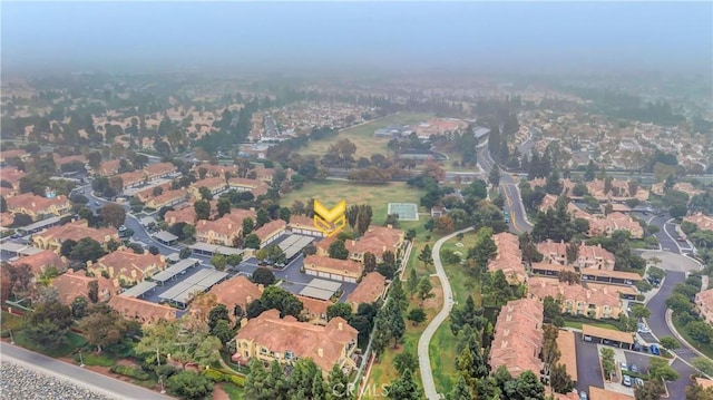 birds eye view of property with a residential view