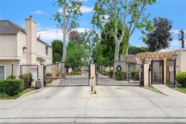 view of gate with fence