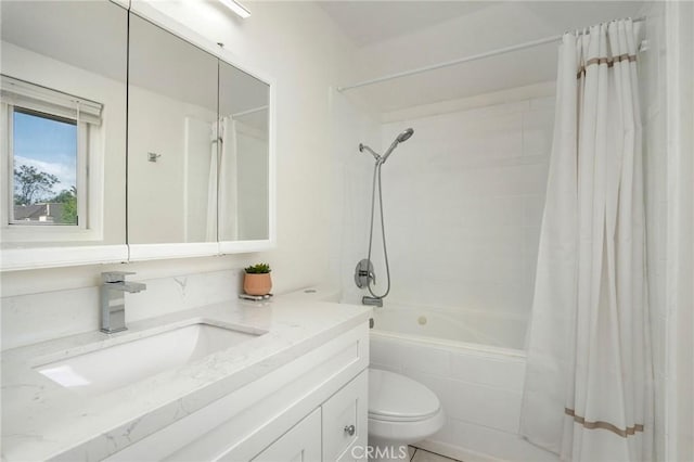 full bathroom with tiled shower / bath combo, toilet, and vanity