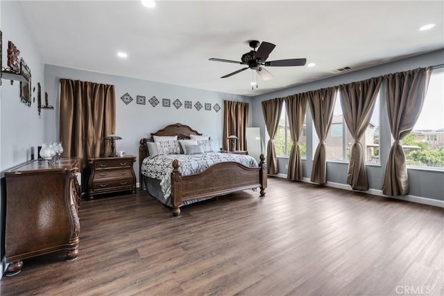 bedroom with recessed lighting, wood finished floors, and visible vents