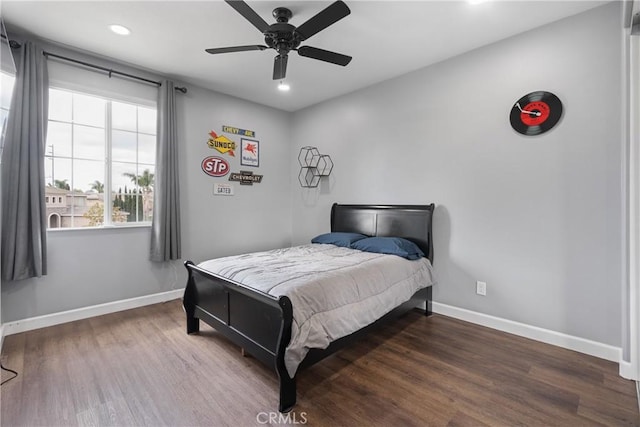 bedroom featuring baseboards, recessed lighting, and wood finished floors