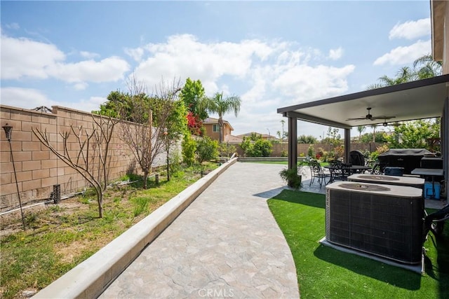 surrounding community featuring a fenced backyard and a patio area