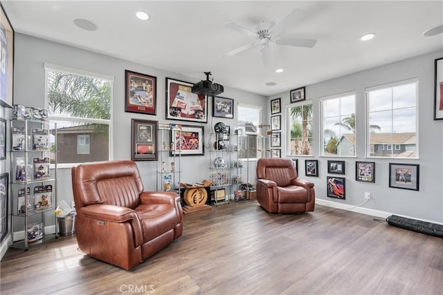sitting room featuring baseboards, ceiling fan, recessed lighting, and wood finished floors