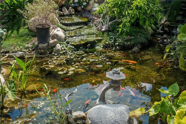 exterior details featuring a small pond