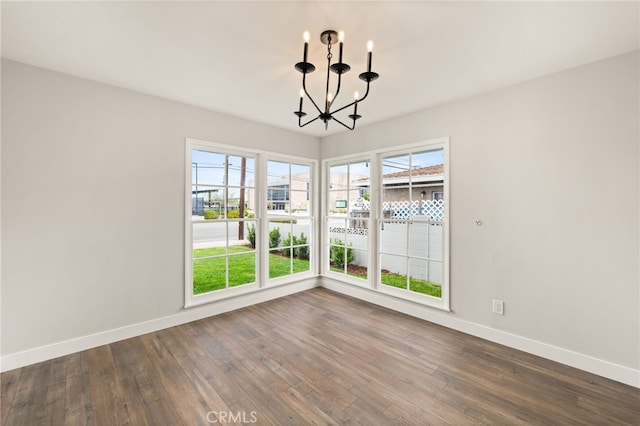 8392 Walker St, La Palma, CA 90623 - unfurnished dining area featuring a chandelier and dark wood-style flooring