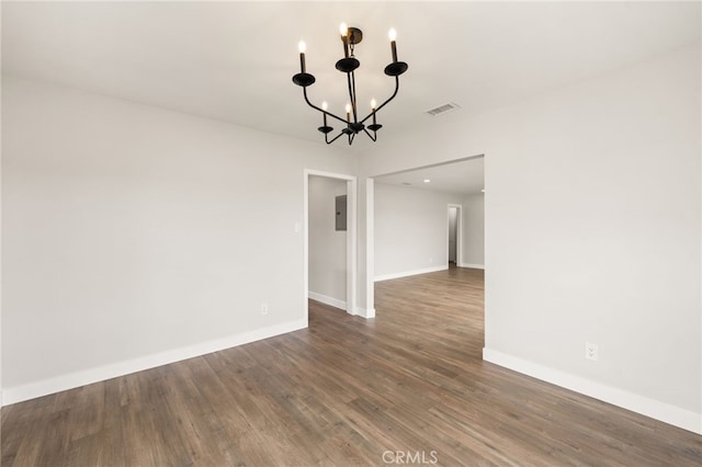 8392 Walker St, La Palma, CA 90623 - spare room with a chandelier, wood finished floors, and electric panel