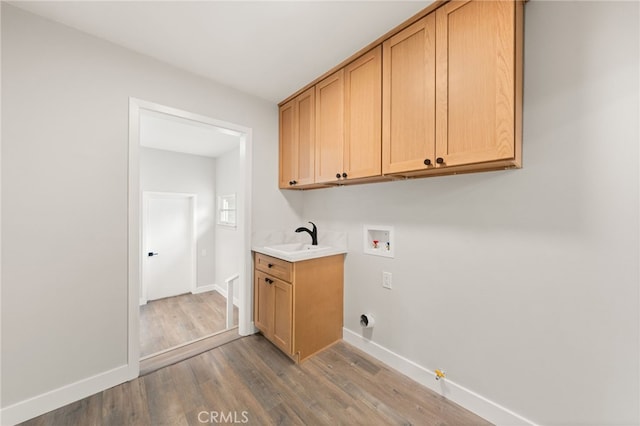 8392 Walker St, La Palma, CA 90623 - washroom featuring hookup for a washing machine, gas dryer hookup, wood finished floors, and cabinet space