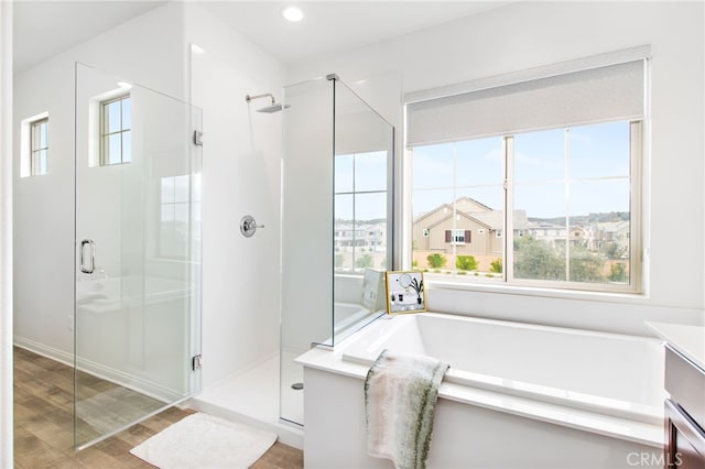 32189 Dymondia Way, Temecula, CA 92591 - bathroom with a stall shower, wood finished floors, vanity, and recessed lighting