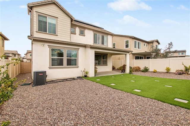back of house with a patio, central AC, a fenced backyard, and stucco siding