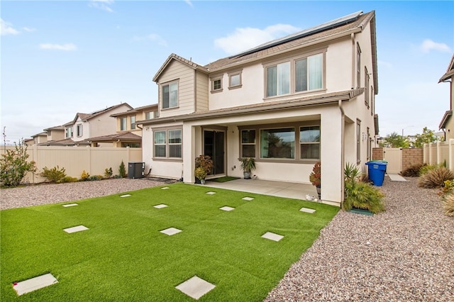 back of house featuring a patio, cooling unit, fence, and stucco siding