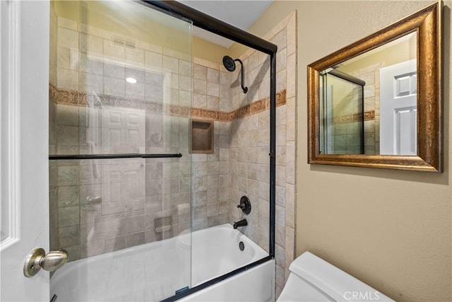 24239 Bella Ct, Newhall, CA 91321 - bathroom with toilet and combined bath / shower with glass door