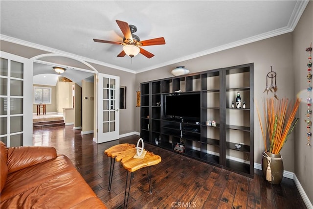 24239 Bella Ct, Newhall, CA 91321 - living area featuring french doors, ceiling fan, arched walkways, hardwood / wood-style flooring, and crown molding