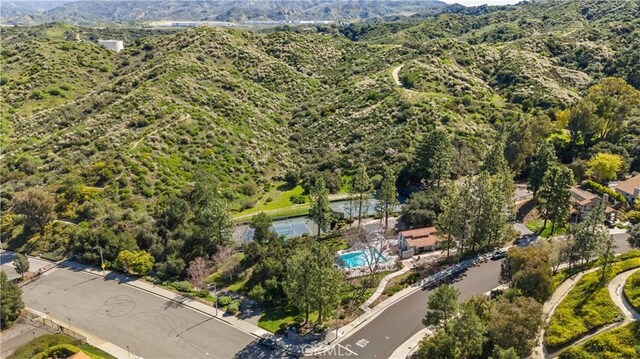 24239 Bella Ct, Newhall, CA 91321 - drone / aerial view of a mountain backdrop and a pool area