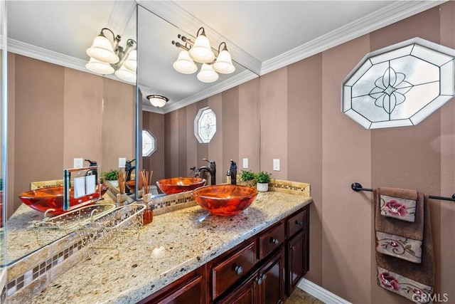 24239 Bella Ct, Newhall, CA 91321 - bathroom featuring crown molding, vanity, and baseboards