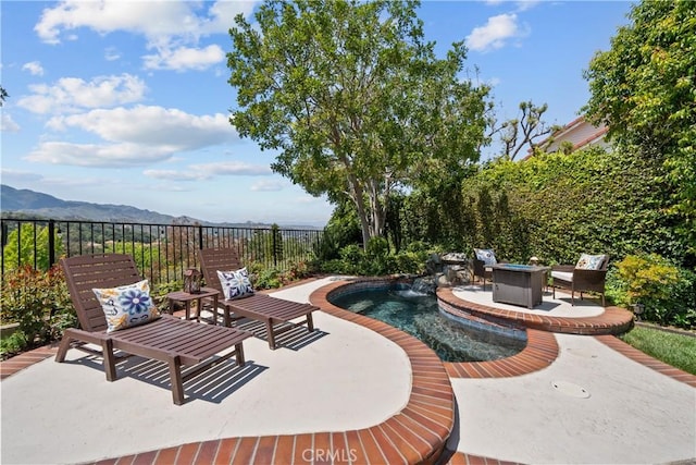 24239 Bella Ct, Newhall, CA 91321 - view of patio with fence, a fire pit, and a mountain view