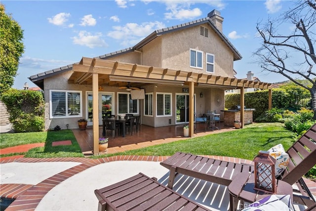 24239 Bella Ct, Newhall, CA 91321 - back of house featuring stucco siding, a ceiling fan, and a patio area