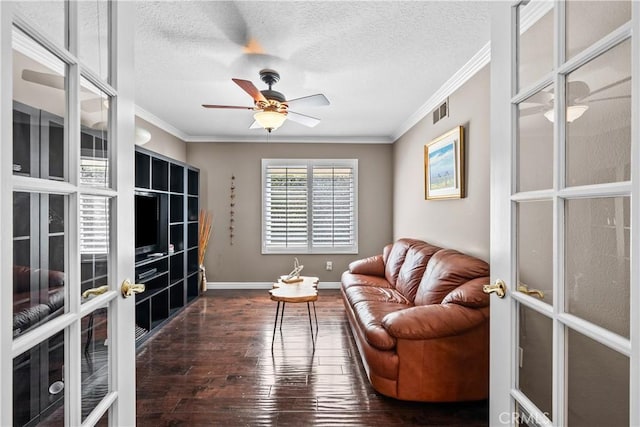 24239 Bella Ct, Newhall, CA 91321 - living area with dark wood-type flooring, crown molding, french doors, ceiling fan, and baseboards