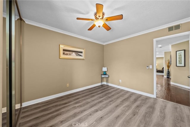 24239 Bella Ct, Newhall, CA 91321 - empty room with wood finished floors, ornamental molding, a ceiling fan, and a textured ceiling