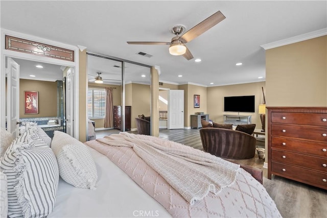 24239 Bella Ct, Newhall, CA 91321 - bedroom with ornamental molding, wood finished floors, baseboards, ceiling fan, and a closet