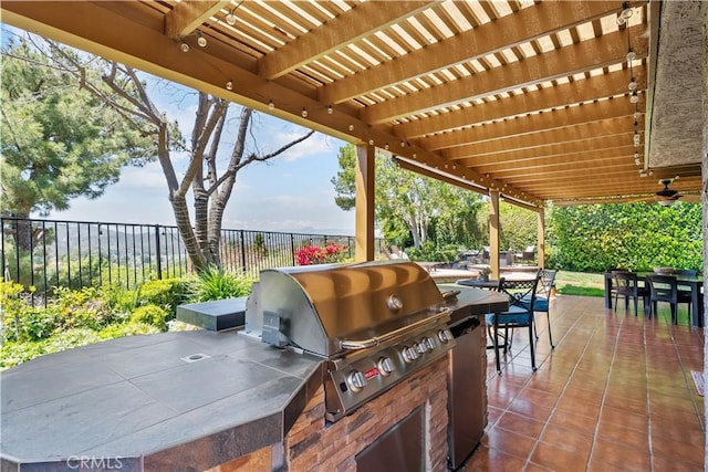 24239 Bella Ct, Newhall, CA 91321 - fenced backyard with outdoor dining area, an outdoor kitchen, a pergola, and a patio area