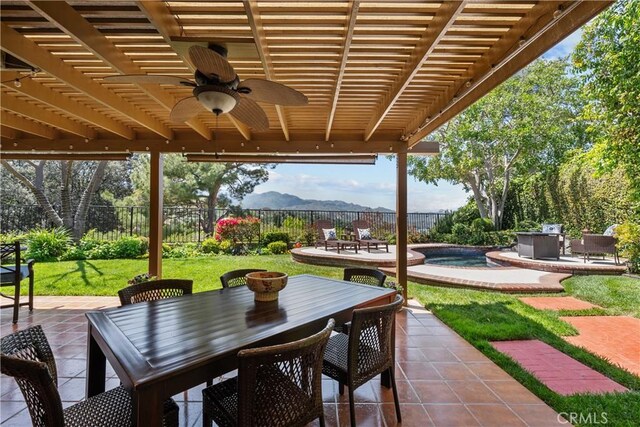 24239 Bella Ct, Newhall, CA 91321 - fenced backyard with outdoor dining space, a patio, a mountain view, and ceiling fan