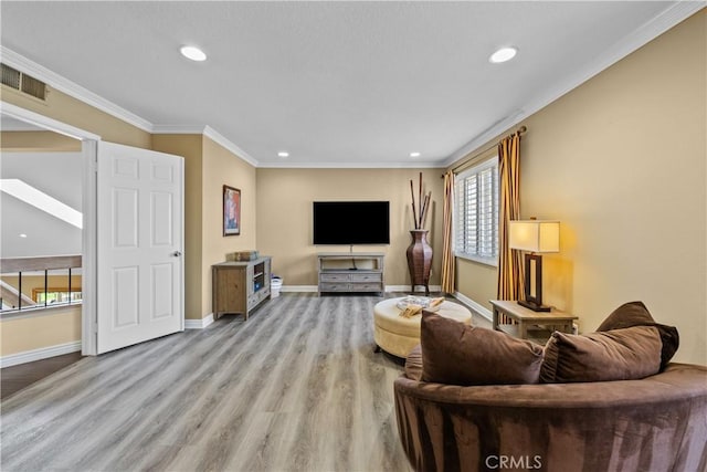 24239 Bella Ct, Newhall, CA 91321 - living area with healthy amount of natural light, recessed lighting, crown molding, baseboards, and wood finished floors