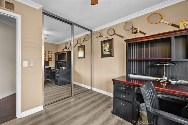 24239 Bella Ct, Newhall, CA 91321 - home office with crown molding, baseboards, and light wood-style floors