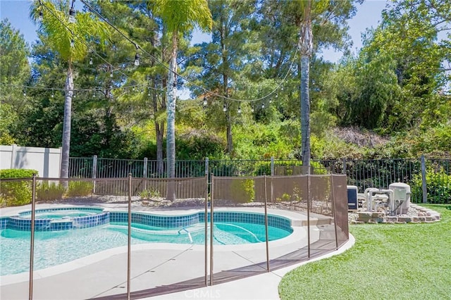 view of swimming pool featuring a patio area, fence, a yard, and a pool with connected hot tub
