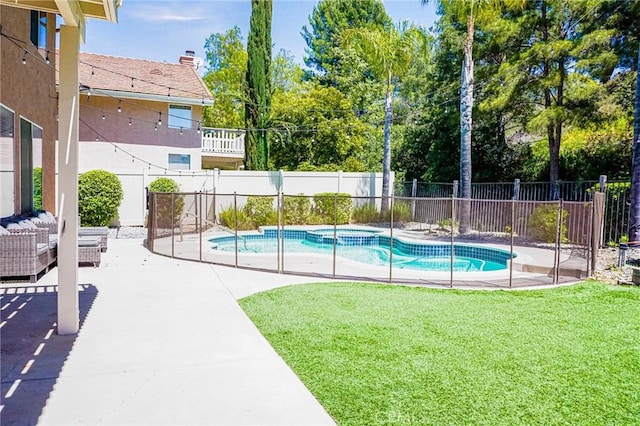 view of swimming pool with fence, a pool with connected hot tub, an outdoor living space, a patio area, and a yard