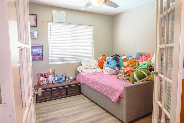 bedroom with ceiling fan and wood finished floors