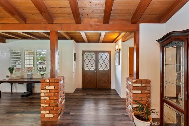 entrance foyer featuring wood ceiling, beamed ceiling, and dark wood-type flooring