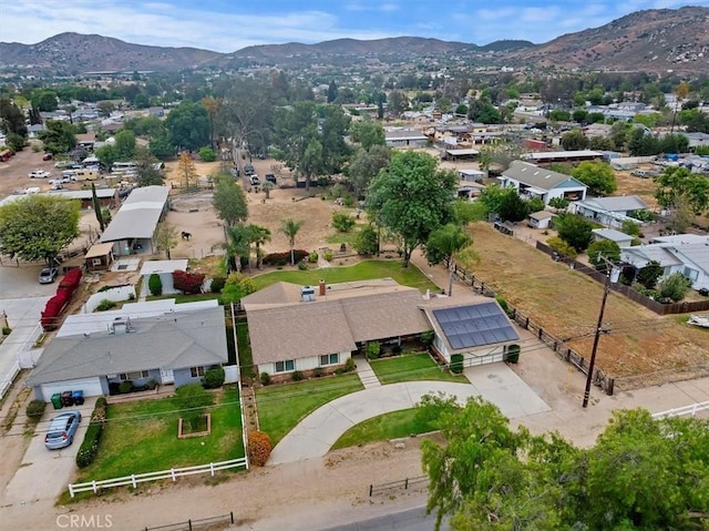 birds eye view of property with a mountain view and a residential view