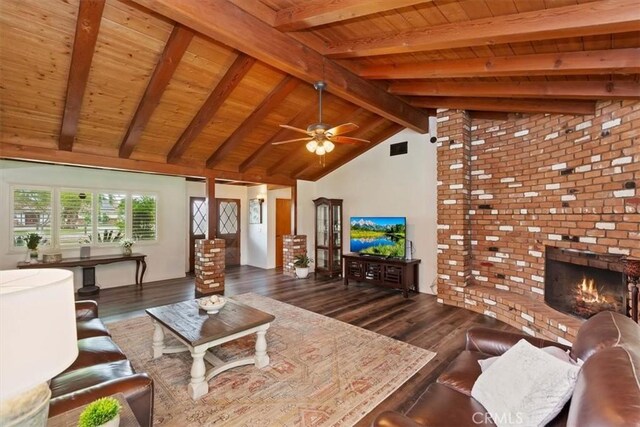 living room with beam ceiling, visible vents, wooden ceiling, and wood finished floors