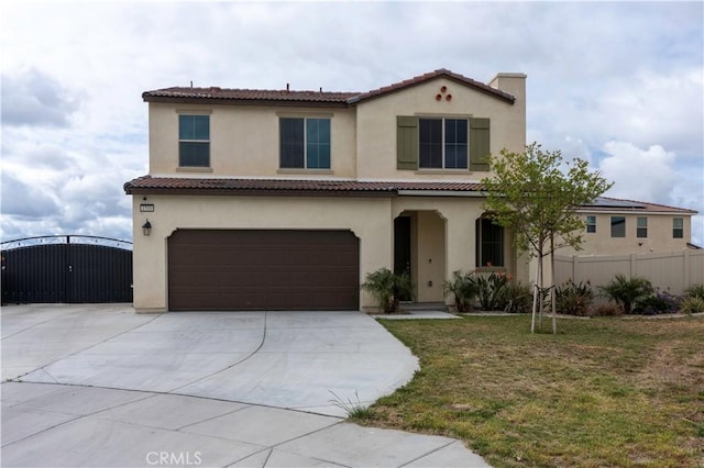 mediterranean / spanish house featuring driveway, a tile roof, fence, an attached garage, and stucco siding
