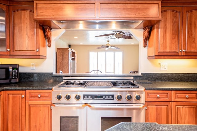 2136 Forbes Ave, Claremont, CA 91711 - kitchen featuring stainless steel appliances, a ceiling fan, brown cabinetry, and dark countertops
